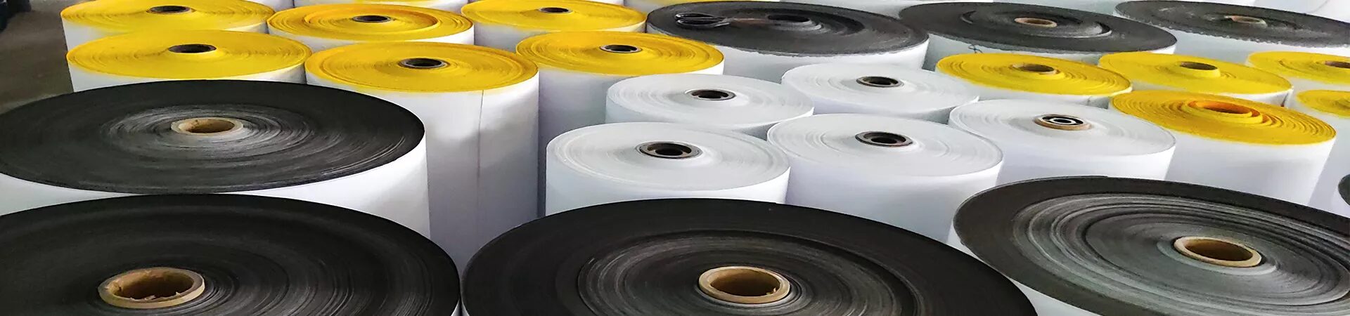 Large rolls of yellow, white and black adhesive tape in the Goeasy factory