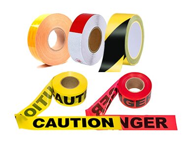 Rolls of reflective and warning tape with a CAUTION barrier tape
